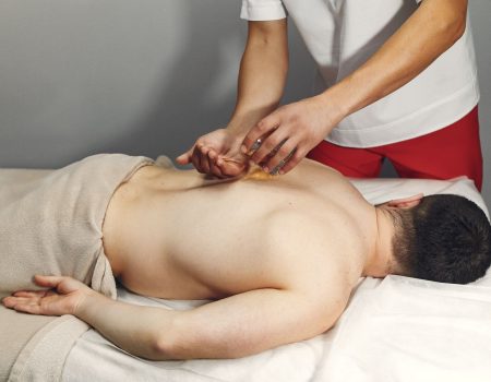 doctor-massages-man-hospital