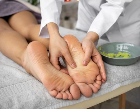 high-angle-woman-getting-massaged-spa